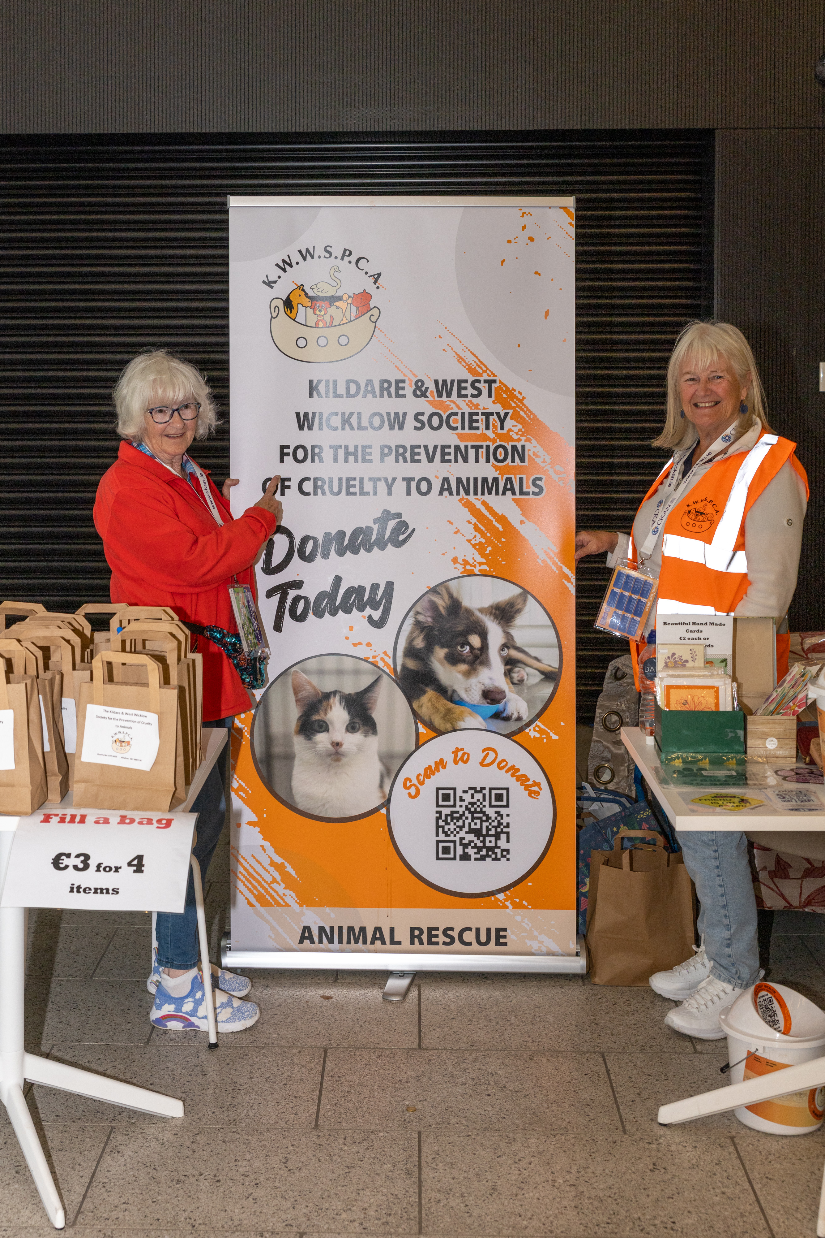 Two people collecting for charity.